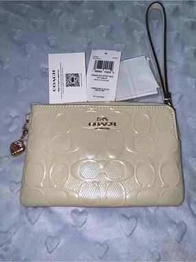 Coach Cream Embossed Signature Wristlet Clutch with Charm